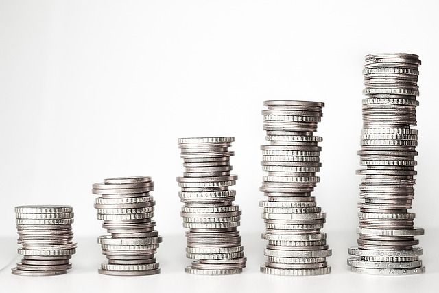 A stack of coins symbolizing the Alora Heights price increase, reflecting the rising cost of homes in the community.